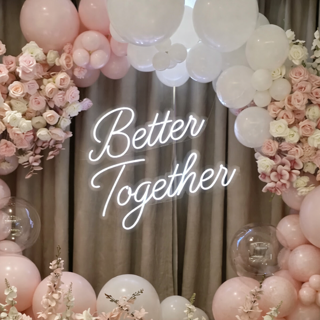 “Better Together” wedding neon sign in LED light with balloon arch backdrop