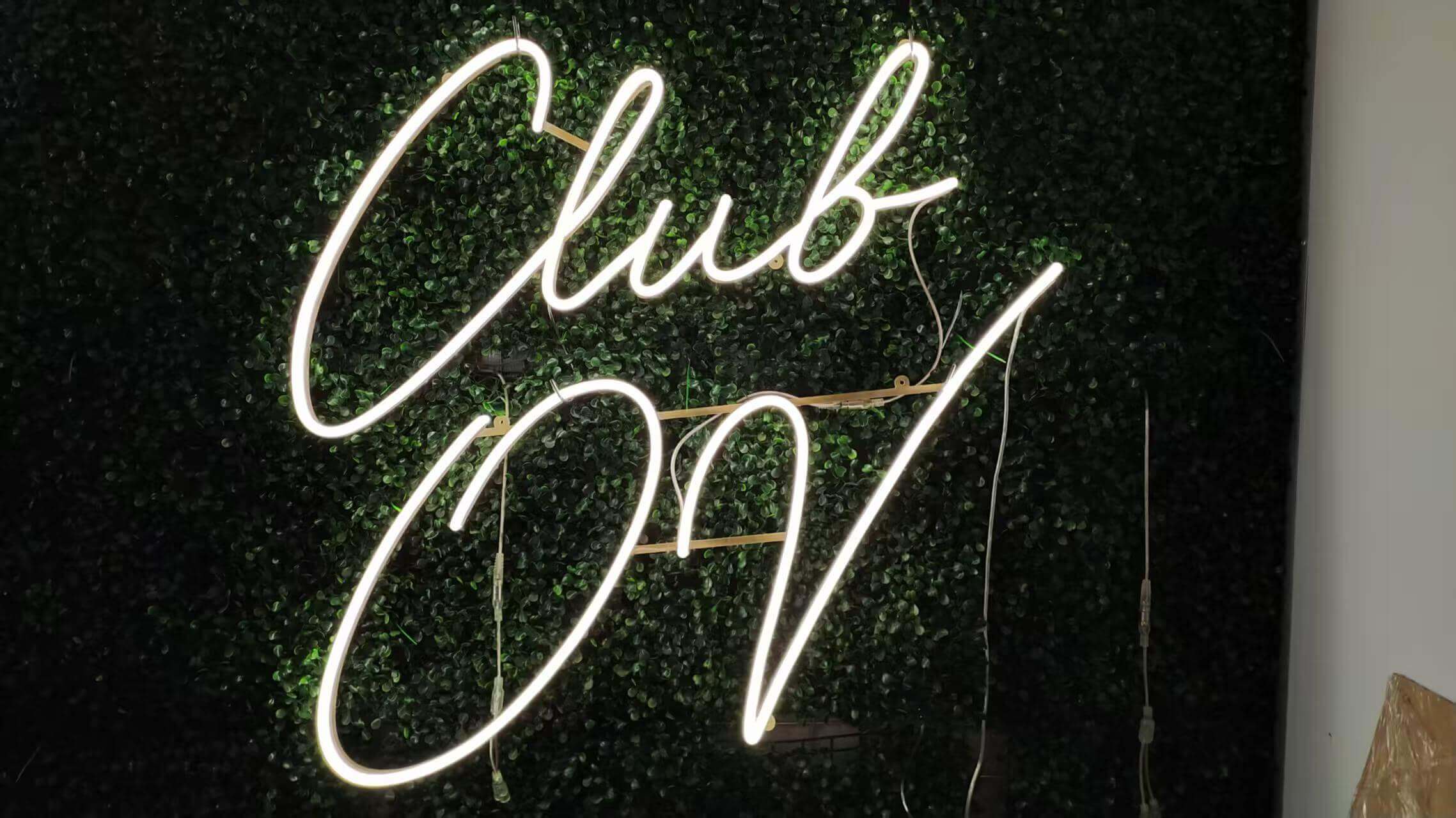 Custom LED neon sign displaying “Club OV” for club interior décor
