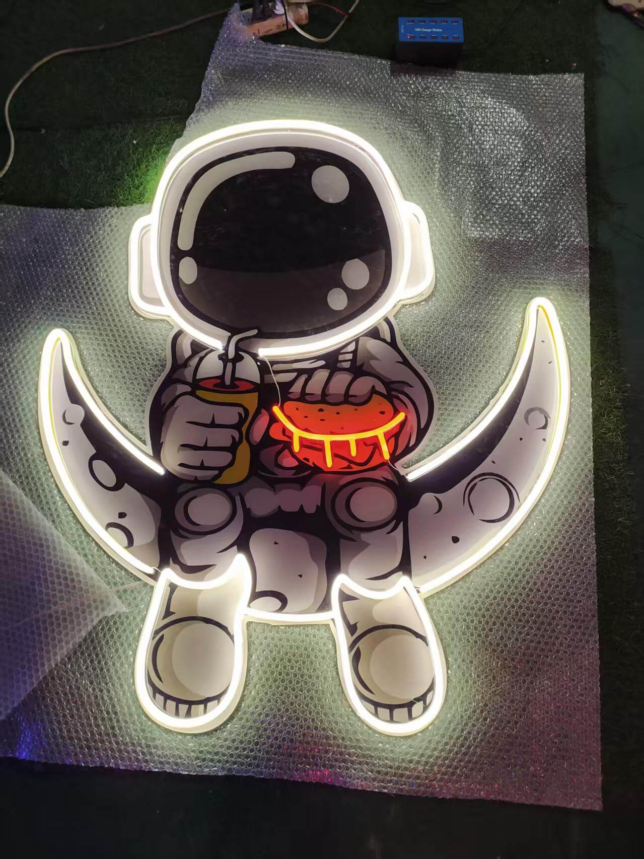 uv printed astronaut lined with custom led neon border