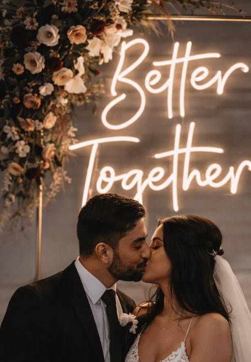 Custom wedding & engagement neon sign for a couple that says better together in warm white