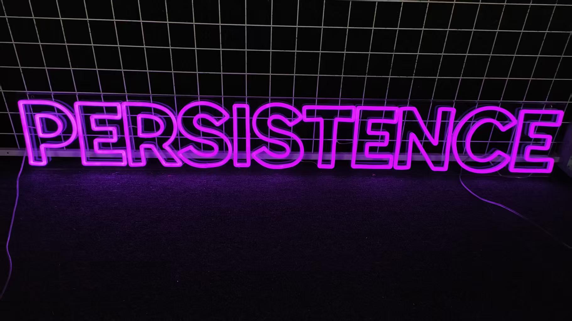 Cut to letter acrylic backing custom neon sign in purple lit up in the dark