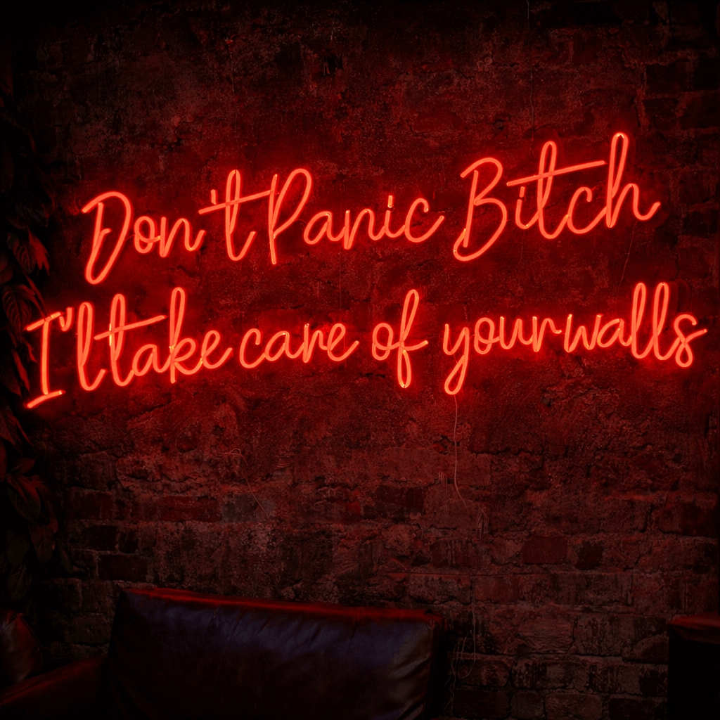 Custom LED neon sign with humorous phrase “Don’t panic bitch, I’ll take care of your walls” in red