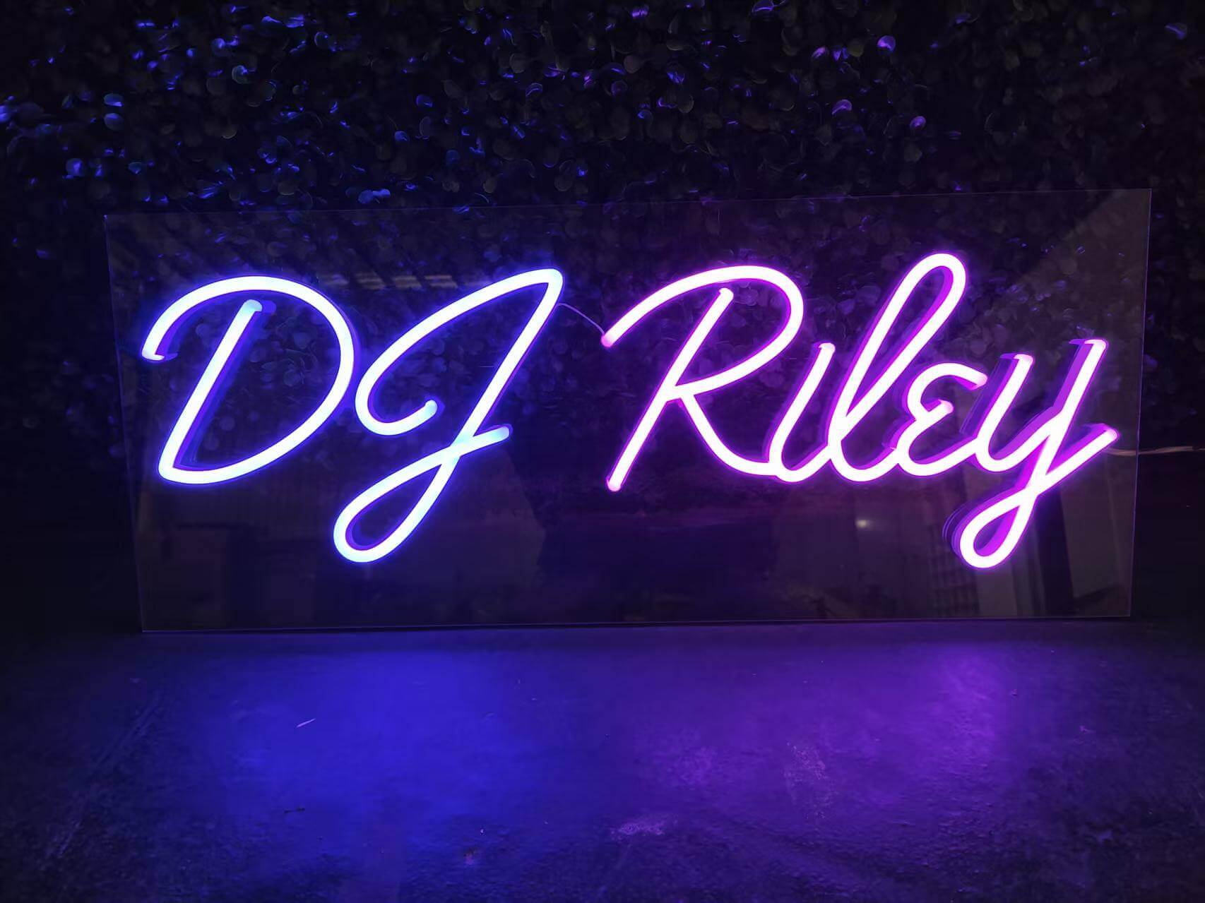 purple dj riley custom neon sign with rectangular acrylic backing for a night club