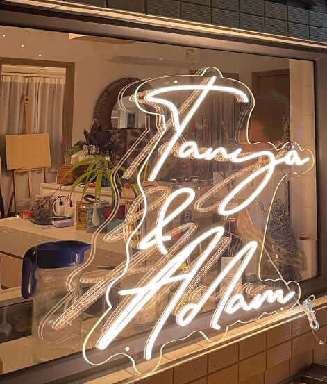 Custom wedding neon sign with “Tanya & Adam” in LED light