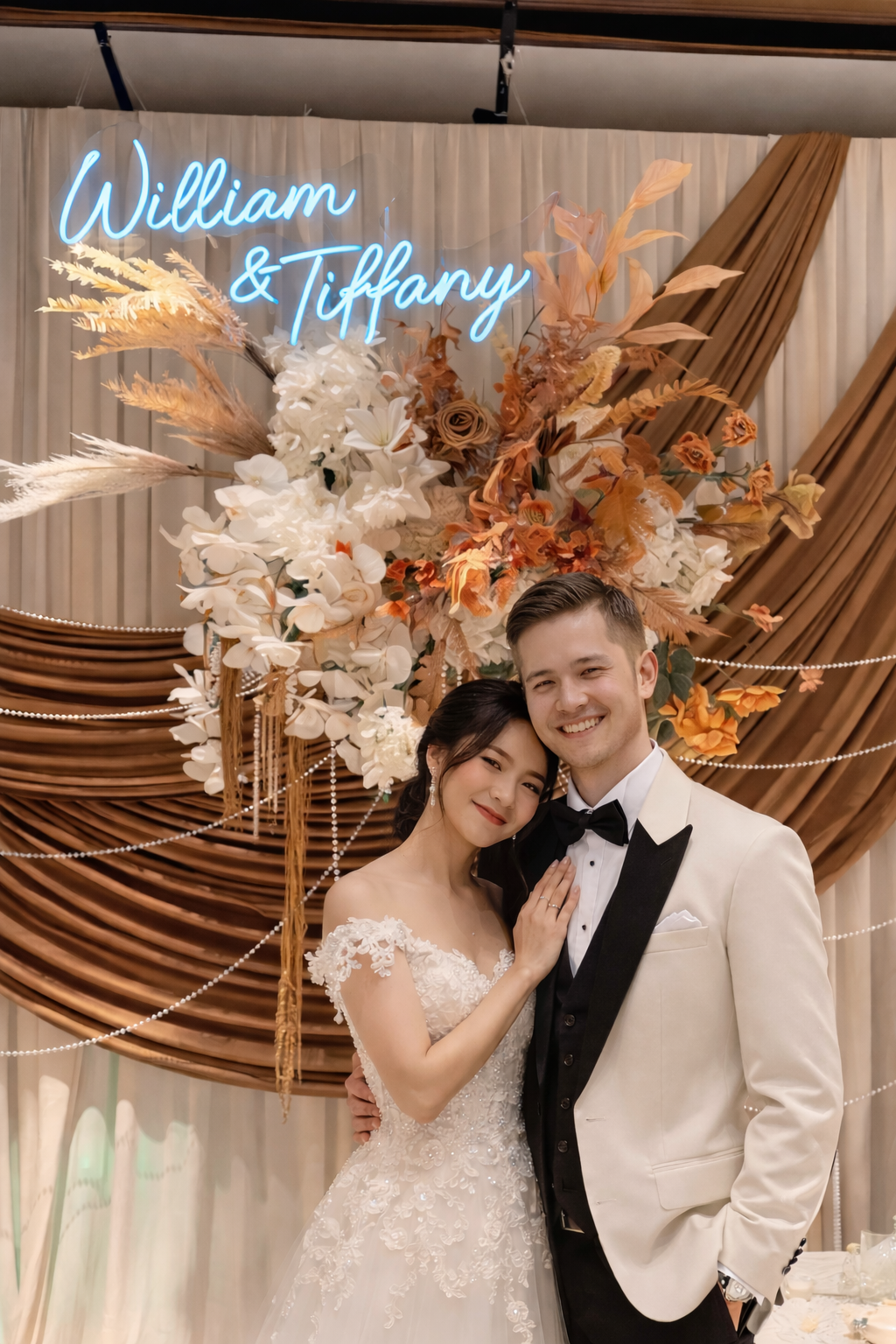 Custom wedding neon sign with “William & Tiffany” in LED light with couple in front