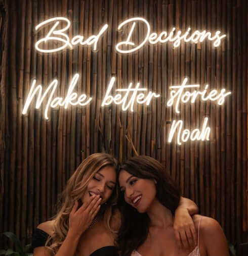 beautiful warm white led neon sign that says bad decisions for a business back drop for customer socials